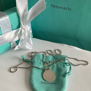 Tiffany & Co. Silver Tag Necklace with Blue Background